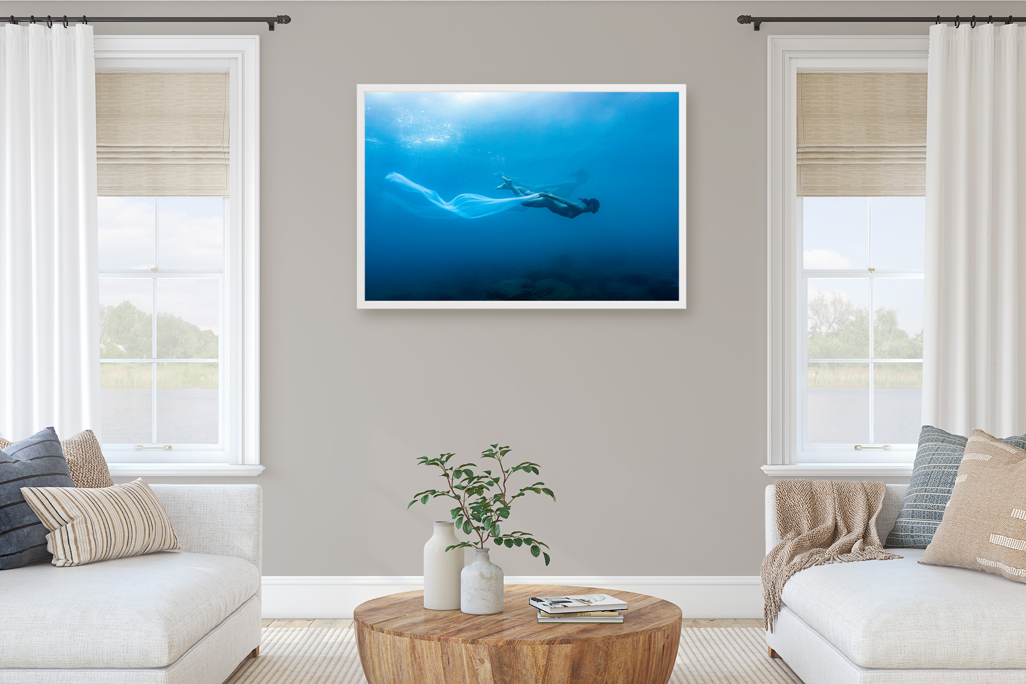Framed underwater photography art portrait on the wall in a living room